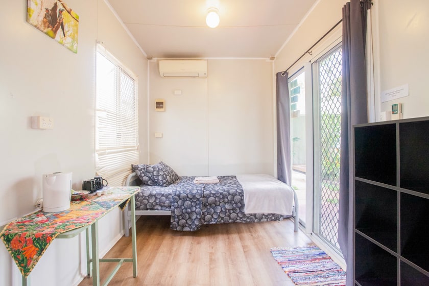 Cape York Accommodation at The Greenhoose - image of a bed in a family room